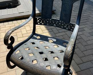 Wrought iron patio table and 8 chairs; includes cushions (see photos of cushions) $1750