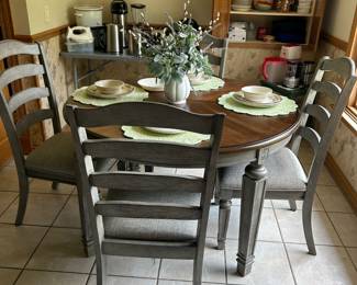This is a brand new set, has a large leaf for more room at the table and has two matching bar stools (bar height) also available.