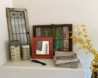 Here are a mix of leaded glass and stained glass offerings, plaus a large key, and a mirror.