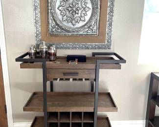 And of course, in addition to the framed art, there is the beverage cart that could be yours.