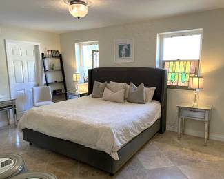 Several items here are worth the look: the bed, lamps, nightstands, and the stained glass windows.