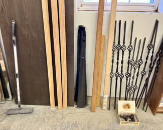 Large woodworking shop with lots of shelving, wood, tools, and equipment.