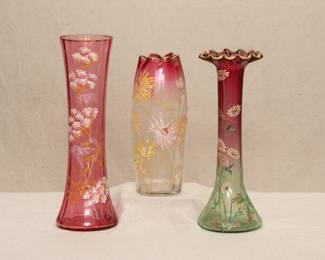 Antique late 19th/early 20th century art glass vases, A cranberry glass vase with applied floral enameling, possibly Legras or Moser; an antique Legras Mont Joye St. Denis "Olga" enameled vase of Rubina cranberry to clear glass, crimped rim, beautifully hand painted chrysanthemums; antique hand blown Rubina Verde art glass vase with applied enamel floral and gilt decoration, likely Bohemian glass by Moser or a Legras vase