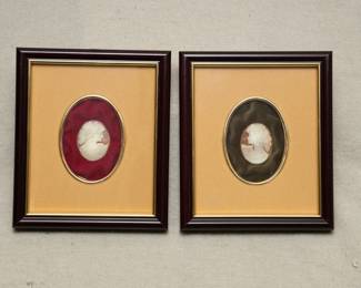 A framed mounted pair of carved cameos; on the back, "Artigianato Torrese Prodotto Originale Inciso a Mano Torre Del Greco Italy"