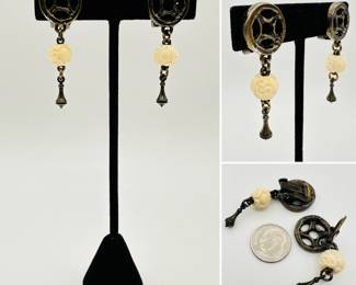 A pair of earrings by Heidi Daus