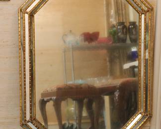 A very large vintage Hollywood Regency style mirror