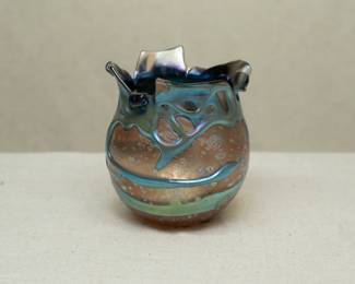 A Charles Lotton Lava Cypriot art glass vase. Signed and dated 1989. Iridescent teal blue gather over gold textured ground. Pinched rim.