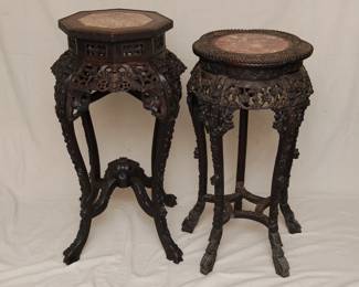 Pair of Chinese hand carved marble topped occasional tables or stands, one with octagonal top and motif of bats and coin symbols, the other with a lobed top and plum blossom and dragons motif