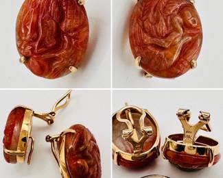 A fabulous pair of 14k yellow gold clip earrings with carved red jade ovals depicting a dragon and a phoenix bird