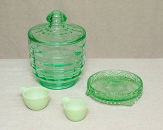 Vintage Anchor Hocking Block Optic green uranium glass candy dish & lid circa 1929-1933, depression glass; a vintage green uranium glass / vaseline glass dish with raised edges, and two vintage Jeanette Glass Jadeite uranium glass tab-handled measuring cups