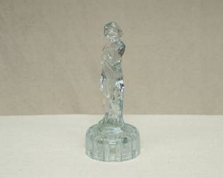 A vintage Cambridge Glass 'Draped Lady' clear glass flower frog