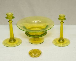 An elegant set of vintage yellow/topaz vaseline glass compote and matching pair of candlestick holders, etched with a trellis and flowers pattern, possibly by Fostoria or Cambridge Glass; and a yellow uranium glass flower frog