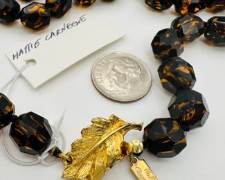 Closeup of Hattie Carnegie bead necklace and earrings set