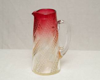 A Rubina glass pitcher, probably unsigned Baccarat Rose Tiente line.