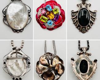 Sterling silver and mother of pearl pendant necklace on silver beaded chain, a sterling silver necklace with brilliant enameled flower and gemstones pendant, and a vintage sterling black onyx and marcasite pendant necklace
