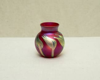 A small glowing iridescent red and gold art glass vase by Charles Lotton (1935-2021), signed and dated 1988