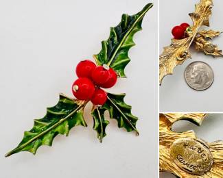 A vintage Hattie Carnegie brooch or pin, enameled and red beads forming of a spray of holly