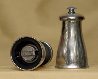 A closer view of the two Peugeot silver plated pepper grinders