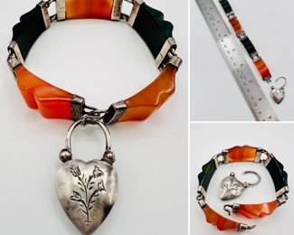A fantastic Scottish antique bracelet of engraved sterling silver connecting carved bloodstone and carnelian agate segments; the clasp with a heart shape silver padlock engraved with flowers on one side and backed with bloodstone on the other. Circa 1870, unsigned, and rather art deco looking for a Victorian piece of Scottish pebble jewelry!