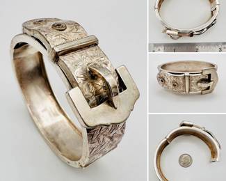 A beautiful antique Victorian sterling silver buckle snap bracelet. Hallmarked for sterling silver, Birmingham, England; dating to 1880s. Intricate hand engraving of floral pattern on hatched ground.