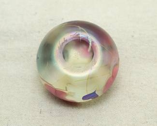 Another view of the Charles Lotton art glass paperweight, Multi Flora design, base with engraved signature, 1977, and #1/300