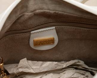Closeup of interior of the Gucci white leather purse / handbag, made in Italy; new with tag