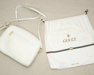 A NWT new with tag Gucci white leather purse and drawstring fabric Gucci bag, both made in Italy; purchased at Marshall Field's
