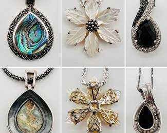 A sterling silver pendant necklace with a teardrop shaped peacock pattern abalone shell and marcasite pendant, a sterling silver and carved mother of pearl flower shape necklace, and an onyx and sterling silver pendant necklace