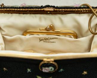 A view of the interior of vintage hand made in France black beaded and Point De Beauvais embroidery handbag, made in France, sold by Saks Fifth Avenue.