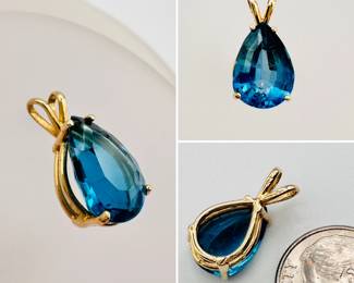 A 14K yellow gold and pear-shaped blue topaz pendant