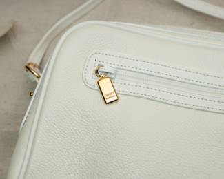 Closeup of the new with tag Gucci white leather purse / handbag