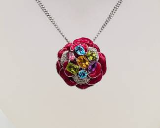 Another view of the a sterling silver necklace with brilliant enameled flower and gemstones pendant