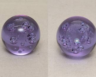 A Swedish art glass paperweight, lavender glass with clear bubbles
