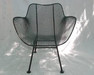 A view of one of three Woodard Sculptura wire lounge chairs in the style of Eames. Designed by Russell Woodard for the Woodard Furniture company Owosso, Michigan.