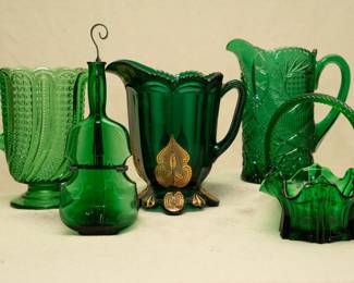 EAPG: A McKee Glass Doric or Feather pattern green glass pitcher, a vintage 1950s Maryland Glass Corporation emerald green glass violin/fiddle bottle, antique Riverside or McKee Glass 'Croesus' pattern green glass pitcher with tabbed feet, decorated with gold paint; vintage Fenton hobstar pinwheel green pitcher, and a vintage emerald green Fenton Art Glass ruffled swirl twisted handled Fenton Lambs Tongue pattern basket