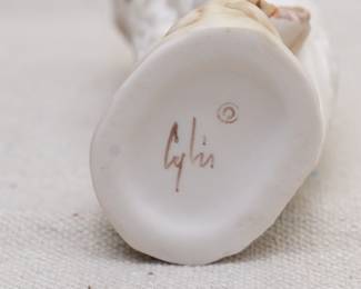 A vintage Cybis porcelain baby white owl on a branch figurine, and Cybis porcelain three rabbits and grapevine figurine