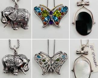 A sterling silver elephant charm necklace, a sterling silver butterfly necklace with multicolored stones, and a "spinner" oval pendant necklace with onyx and mother of pearl