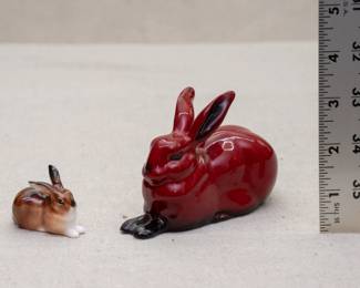 A Royal Doulton rabbit figurine, and a Royal Doulton flambé glaze rabbit figurine