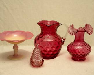 A Pairpoint early Burmese glass ruffled form compote in yellow to salmon pink, a vintage Fenton petal pink pear 2-piece trinket dish, an antique 19th C. cranberry art glass pitcher by Hobbs Brockunier in their Polka Dot pattern (also known as inverted thumbprint, or coin dot), a vintage Fenton ruby overlay vase small fine dot optic / reverse thumbprint, pinched ruffle (1958 to 1962)