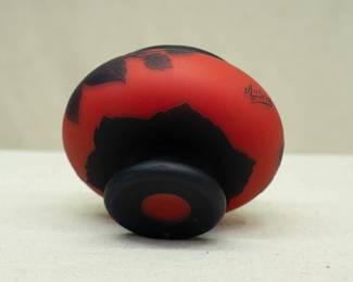 Another view of the 1920s Art Nouveau cameo art glass footed vase, compressed globular form with glowing mandarin red with black overlay of carved leaves and blossoms floral design. Signed Richard, which was made by Loetz for the Edmond Etling boutique in Paris.
