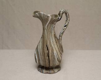 A 19th century Staffordshire Agateware ewer, marbleized decoration, with molded handle and petal shaped foot
