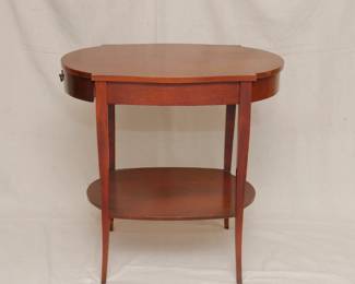 Another view of the pair of vintage MCM style tiered side tables