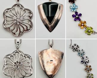 A sterling silver and diamond cutout flower blossom pendant necklace, an arrowhead shape onyx and sterling silver pendant necklace, and a delicate sterling silver necklace with five flower shapes of garnet, topaz, amethyst, citrine, and—likely—peridot.