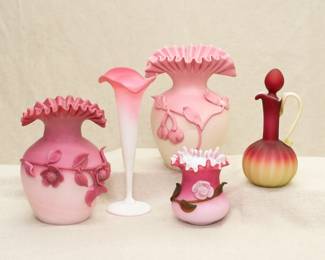 Assorted peachblow art glass: A Mt Washington matte finish peachblow vase with ruffled mouth and applied floral sprigs around the shoulder, a beautiful antique satin finish peach blow lily vase, possible New England Glass, Libbey Glass Co, or Mt Washington; a subtle matte Burmese glass vase with ruffled mouth and applied fruiting branches, a peachblow cased vase with double crimped rim, applied opaque glass flower and frosted brown glass leaves, and a satin finish Wheeling peachblow cruet.