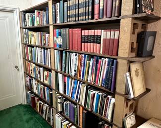 Hundreds of books on glass, gardening, jewelry, travel, history, World War II, and more (plus that the mid century modern patio block bookcase is for sale too!)