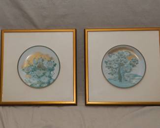 Pair of framed porcelain enameled plates with Asian style birds and flowers