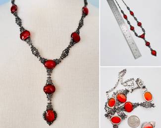 A ravishing bit of 19th century meets Art Deco, in sterling silver. Rich red cabochons in sterling silver frames between dimensional metal and rhinestone Art Deco style links with a continuing 2 stone pendant.