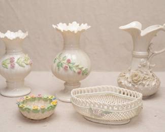 A Belleek Fermanagh Ireland Ribbon spill vase, a Belleek Ireland Ribbon vase, a Belleek Fermanagh Ireland Aberdeen Ewer, a Belleek Ireland
Birds Nest Basket, a Belleek Ireland oval basket