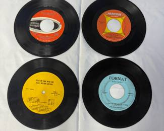 Vintage 45 RPM records from The NBC Rhythm Secction, Dionne Warwick, Chubby Checker, and The Four Naturals