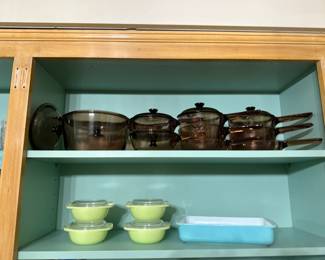 Unused Corning Visions saucepans set, a Pyrex turquoise baking dish, and a set of four vintage Pyrex lime green individual casserole dishes with lids.